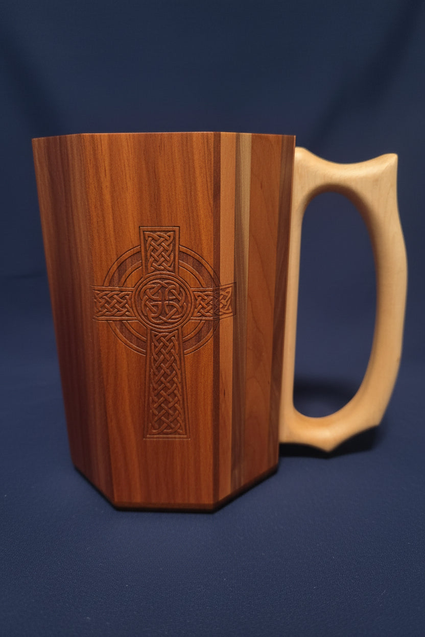 Wooden Jouster tankard showing dark walnut side with Celtic cross engraving and light maple handle, side view
